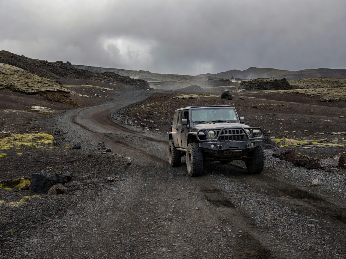 High clearance 4x4 rig parked along volcanic highlands gravel track