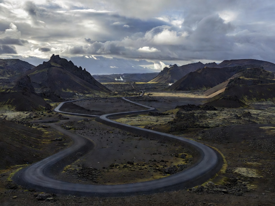 Panoramic view of Icelandic Route 1 Ring Road through volcanic valley